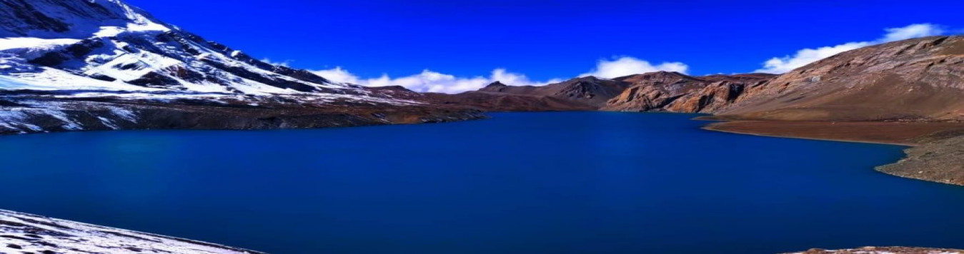The all blue Tilicho lake enjoying the lap of the mountains.